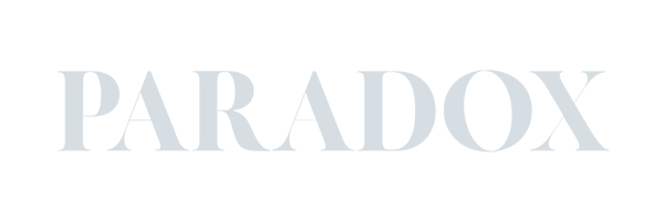 The image features the word "PARADOX" in large gray letters on a transparent background, showcasing the sleek aesthetic typical of Conte Studios, a renowned brand design agency in Toronto. Conte Studios